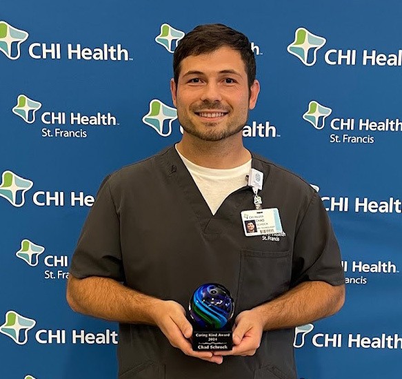 Photo of Chad Schock with Caring Kind Award