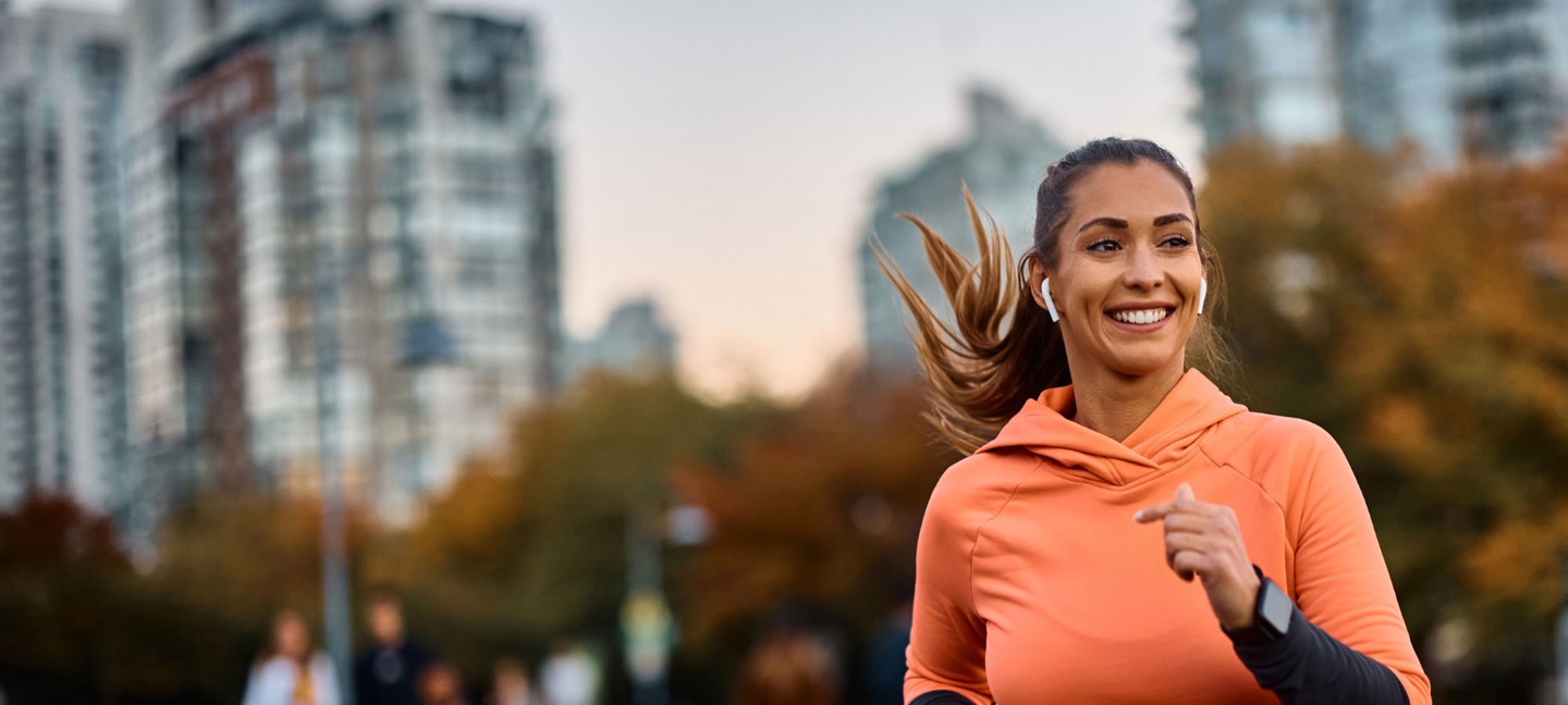 Young woman running in city