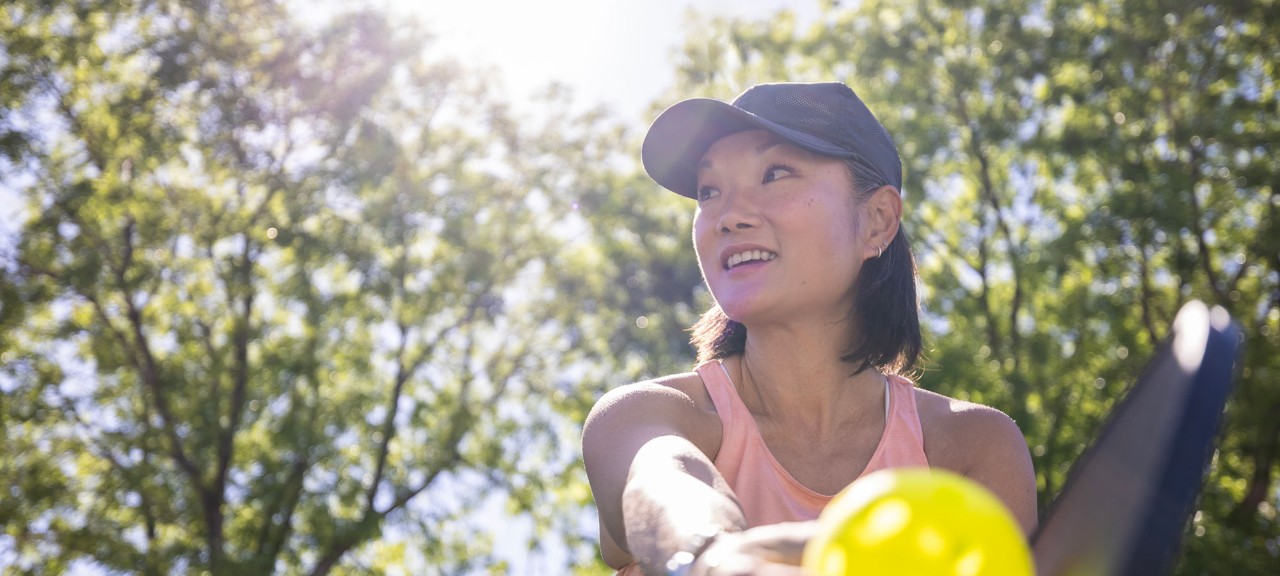 Young woman playing pickleball